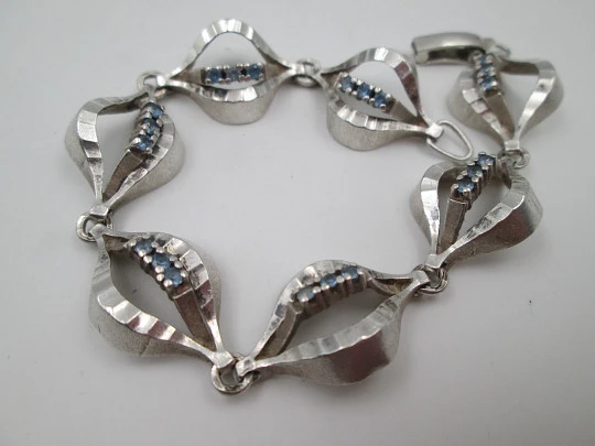 Openwork rhombus articulated ladie's bracelet. Sterling silver & blue gems. 1970's