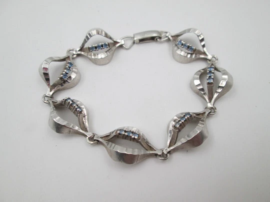 Openwork rhombus articulated ladie's bracelet. Sterling silver & blue gems. 1970's