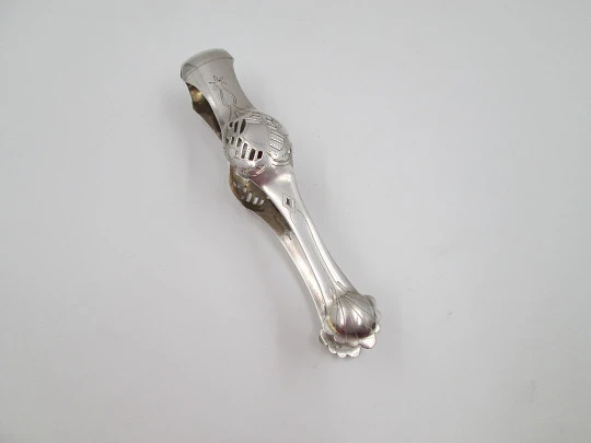 Ornate ice tongs. Sterling silver. Openwork design. Geometric chiseled and shells. 1950's