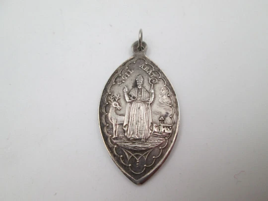 Our Lady of Nuria (Queralbs) and San Gil sterling silver medal. Ring on top. Spain. 1890's