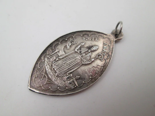 Our Lady of Nuria (Queralbs) and San Gil sterling silver medal. Ring on top. Spain. 1890's