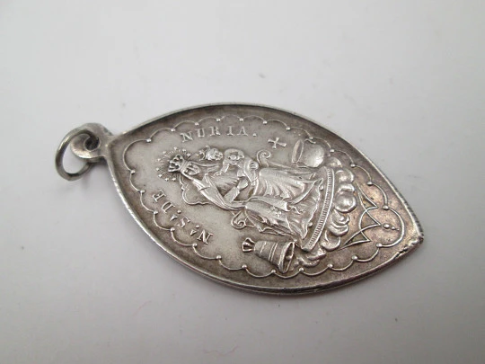 Our Lady of Nuria (Queralbs) and San Gil sterling silver medal. Ring on top. Spain. 1890's