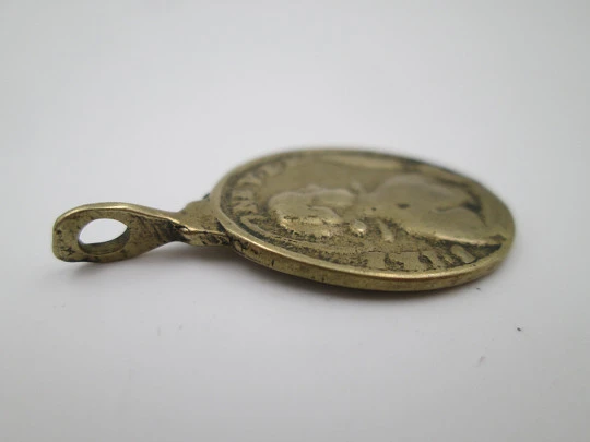 Oval bronze relief medal. Saint Barbara and hermitage. Turned ring on top. 19th century