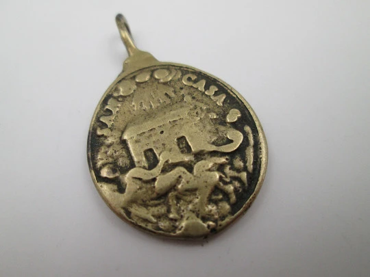 Oval bronze relief medal. Saint Barbara and hermitage. Turned ring on top. 19th century