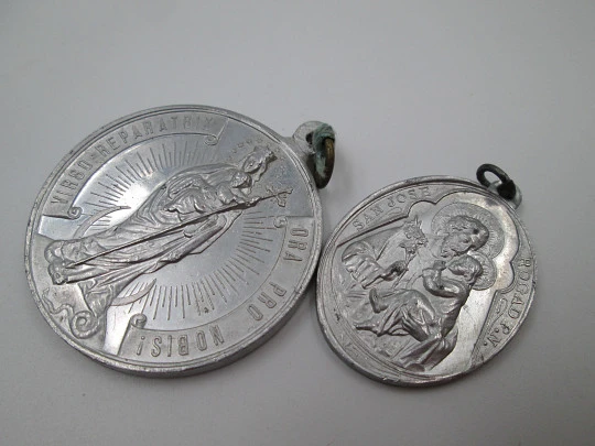 Pair of aluminum religious medals. Saint Joseph and Immaculate Conception. 1950's