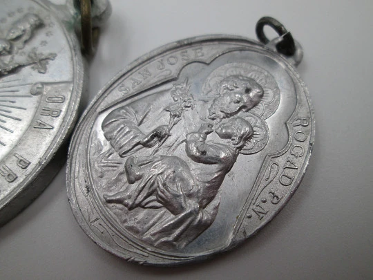 Pair of aluminum religious medals. Saint Joseph and Immaculate Conception. 1950's