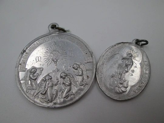 Pair of aluminum religious medals. Saint Joseph and Immaculate Conception. 1950's