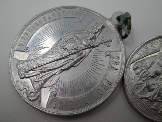 Pair of aluminum religious medals. Saint Joseph and Immaculate Conception. 1950's