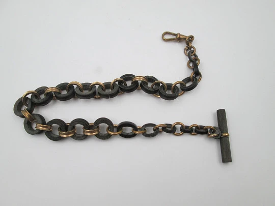 Pocket watch decreasing links chain. Gold plated and hard rubber. T-Bar. Europe. 1890's