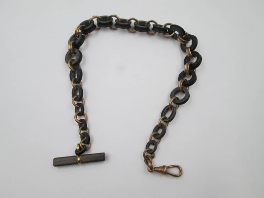 Pocket watch decreasing links chain. Gold plated and hard rubber. T-Bar. Europe. 1890's