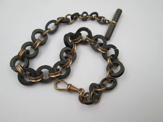 Pocket watch decreasing links chain. Gold plated and hard rubber. T-Bar. Europe. 1890's