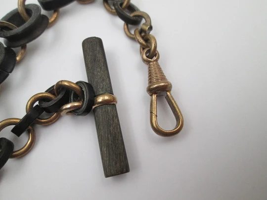 Pocket watch decreasing links chain. Gold plated and hard rubber. T-Bar. Europe. 1890's