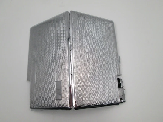 Polo cigarette case with petrol lighter. Silver plated metal. Rhombus and waves motifs