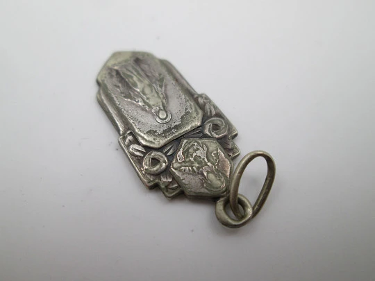 Religious medal. Virgin Mary and Jesus Christ. Silver plated metal. Ring on top. Spain. 1940's