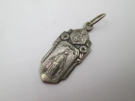 Religious medal. Virgin Mary and Jesus Christ. Silver plated metal. Ring on top. Spain. 1940's