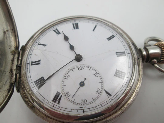 Reloj bolsillo media saboneta Dennison. Plata de ley. Pequeño segundero. 1890. Inglaterra