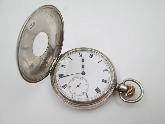 Reloj bolsillo media saboneta Dennison. Plata de ley. Pequeño segundero. 1890. Inglaterra