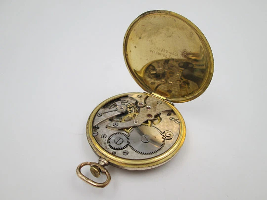 Reloj de bolsillo art decó Tempo. Laminado en oro 14k. Cuerda manual. Suiza. 1930