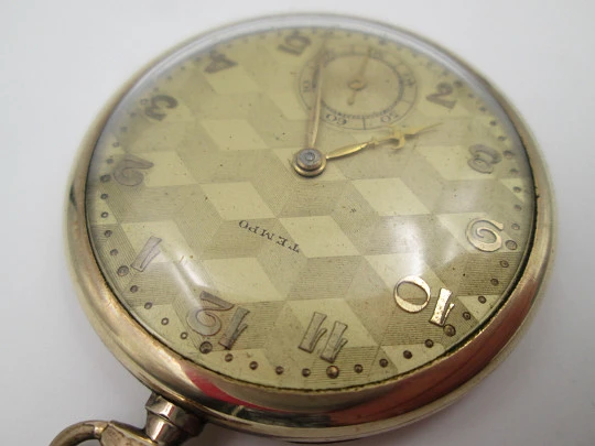 Reloj de bolsillo art decó Tempo. Laminado en oro 14k. Cuerda manual. Suiza. 1930