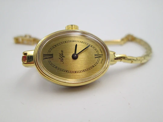 Reloj pulsera mujer Alfex. Chapado oro / acero. Brazalete. Cuerda manual. Funda. 1970