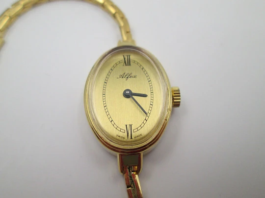 Reloj pulsera mujer Alfex. Chapado oro / acero. Brazalete. Cuerda manual. Funda. 1970