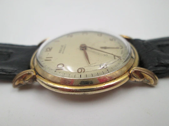 Revue art deco. 20 microns rolled gold. Manual winding. Small seconds hand. Swiss. 1930's