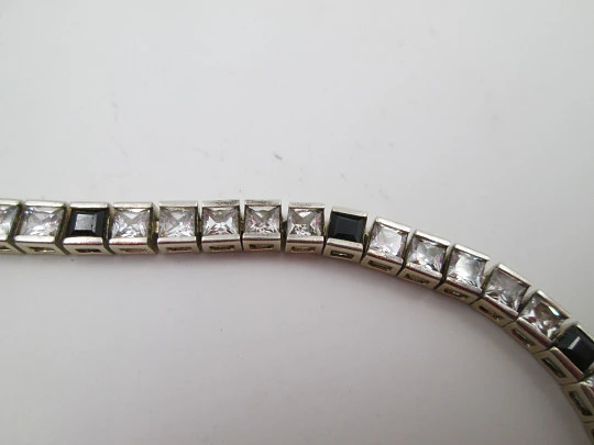 Riviere bracelet. Sterling silver & vermeil. White sapphires and blue gems. 1980's