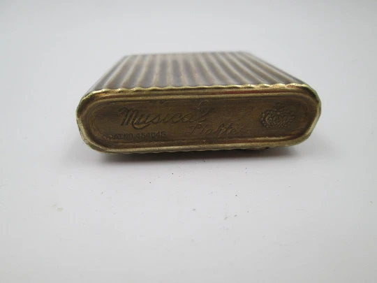 Royal Crown musical petrol pocket lighter. Gold plated metal. Ribbed pattern. Japan