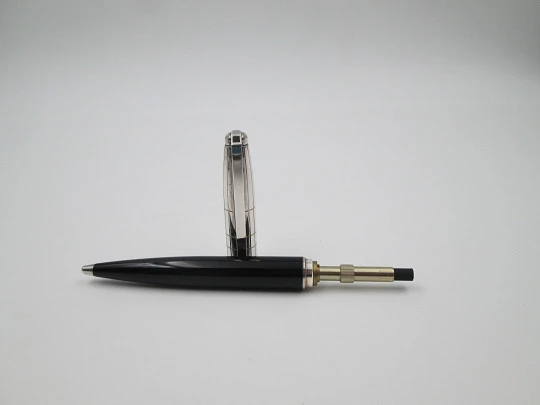 S. T. Dupont ballpoint pen. Black resin and platinum plated. Twist system. 1990's. France