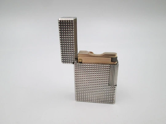 S. T. Dupont Paris lighter. Silver and gold plated. Diamond pattern. France. 1990's