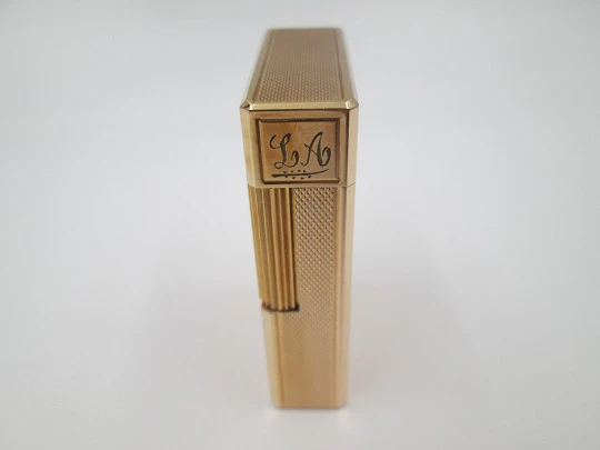 S.T. Dupont gas lighter. 20 microns gold plated. Cloth cover. France. 1990's