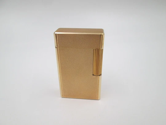 S.T. Dupont gas lighter. 20 microns gold plated. Cloth cover. France. 1990's