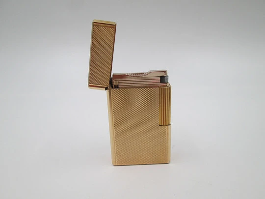 S.T. Dupont gas lighter. 20 microns gold plated. Cloth cover. France. 1990's