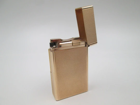 S.T. Dupont gas lighter. 20 microns gold plated. Cloth cover. France. 1990's