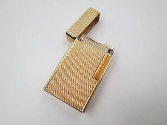 S.T. Dupont gas lighter. 20 microns gold plated. Cloth cover. France. 1990's