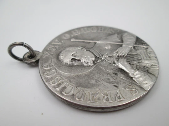 Saint Francis of Assisi and Immaculate Conception medal. Silver plated metal. 1950's