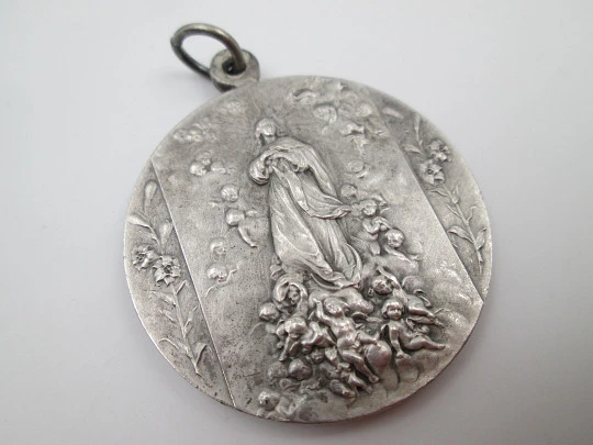 Saint Francis of Assisi and Immaculate Conception medal. Silver plated metal. 1950's