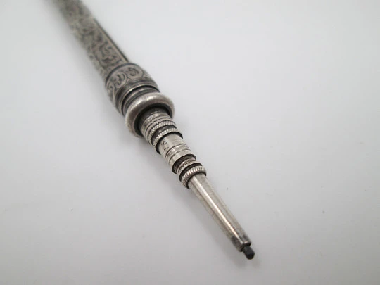 Sampson Mordan mechanical pencil. Silver plated. Black stone. Vegetable motifs. 1890's