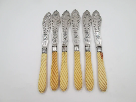 Set of six openwork fish knives. Cod swimming in water spiral. Silver plated. England. 1900's