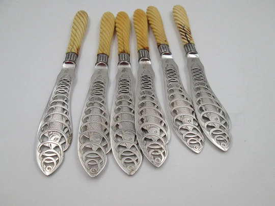 Set of six openwork fish knives. Cod swimming in water spiral. Silver plated. England. 1900's