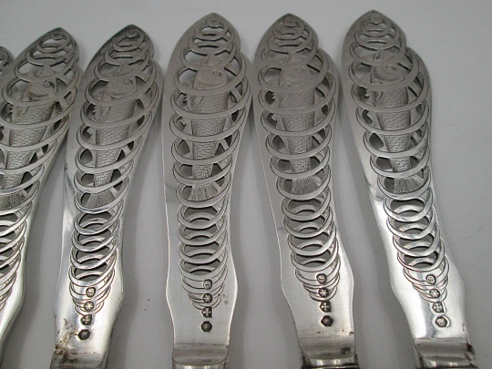 Set of six openwork fish knives. Cod swimming in water spiral. Silver plated. England. 1900's