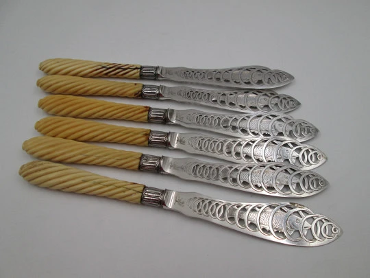 Set of six openwork fish knives. Cod swimming in water spiral. Silver plated. England. 1900's