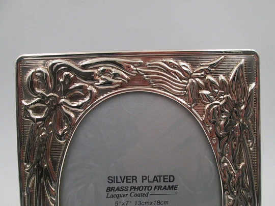 Silver plated brass photo frame. Floral motifs and plant decorations. 1990's. Europe