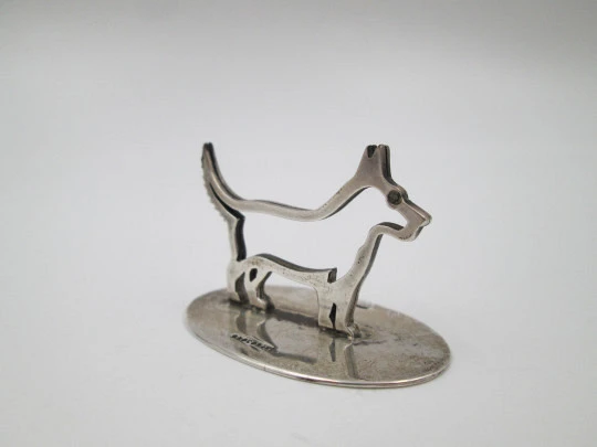 Sterling silver business card holder. Dog openwork figure. United Kingdom. 1910's