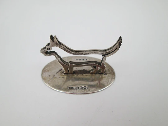 Sterling silver business card holder. Dog openwork figure. United Kingdom. 1910's