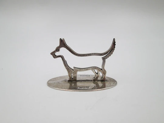 Sterling silver business card holder. Dog openwork figure. United Kingdom. 1910's