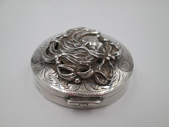 Table pillbox. 925 sterling silver. Women's bust high relief. Articulated lid. 1970's. Europe