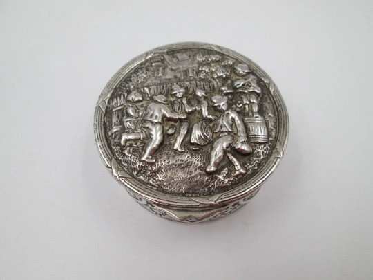 Table pillbox. Sterling silver and vermeil. High relief celebration scene. 1960's. Europe