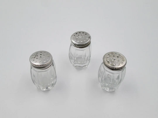 Three salt shakers set. Sterling silver screw caps and carved crystal bodies. 1960's