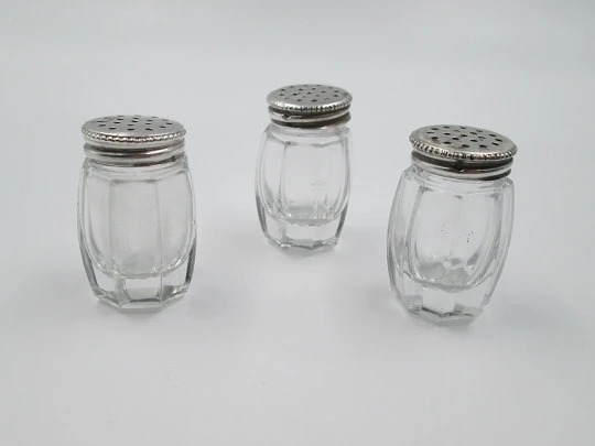 Three salt shakers set. Sterling silver screw caps and carved crystal bodies. 1960's